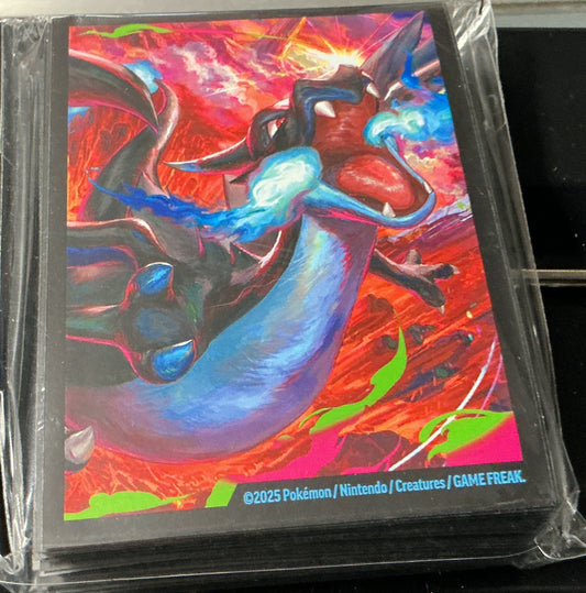 Colorful trading card in protective packaging on a black surface